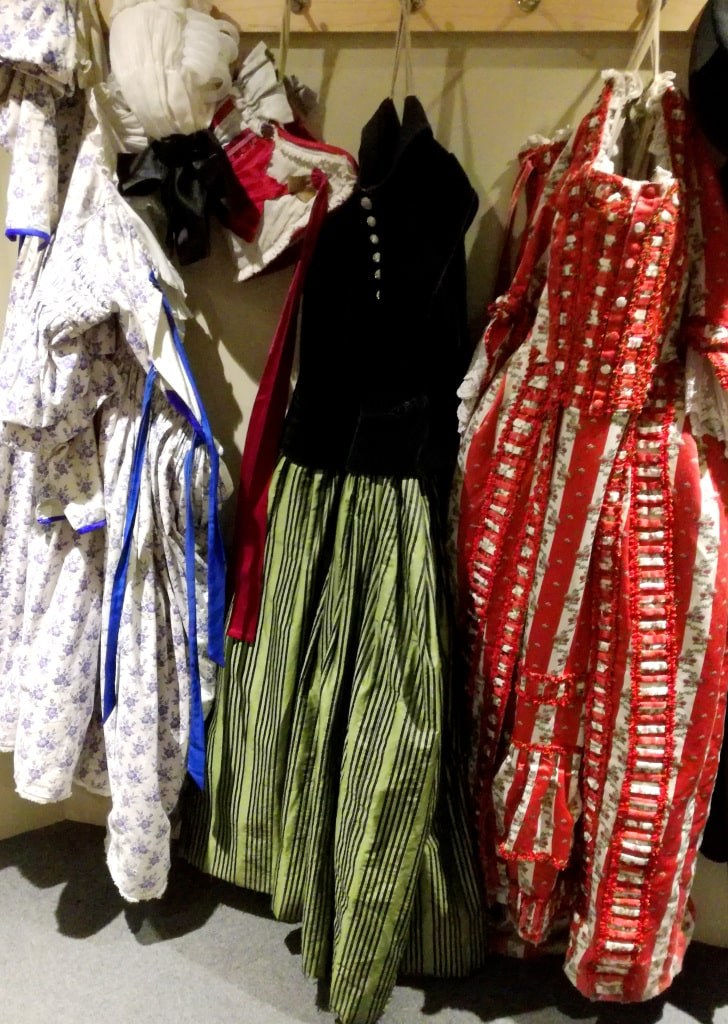 womens_dresses_hanging_on_a_wall