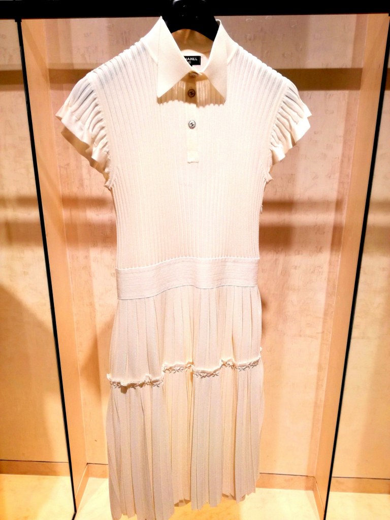 a_white_elegant_dress_in_the_chanel_butic_in_paris