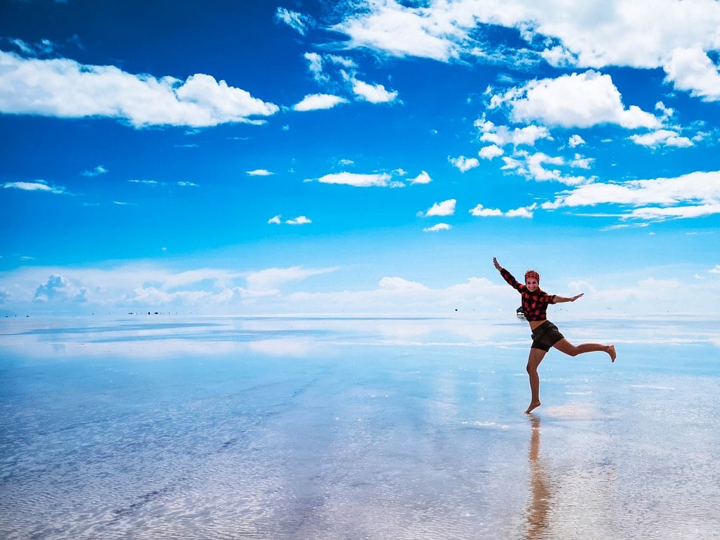blonde-girl-jumping-over-clouds