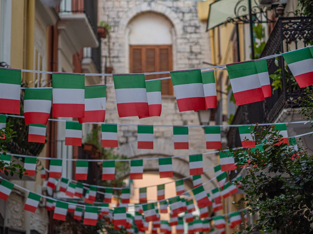 dozens_of_italian_flags_waving_above_bari_street