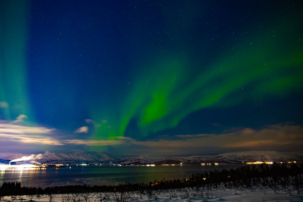the_northern_light_viewed_over_tromso